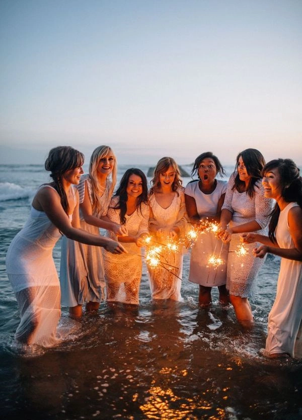 Effortless messy beach wave look for a playful bachelorette celebration Bride-to-be with messy beach waves hairstyle at bachelorette party