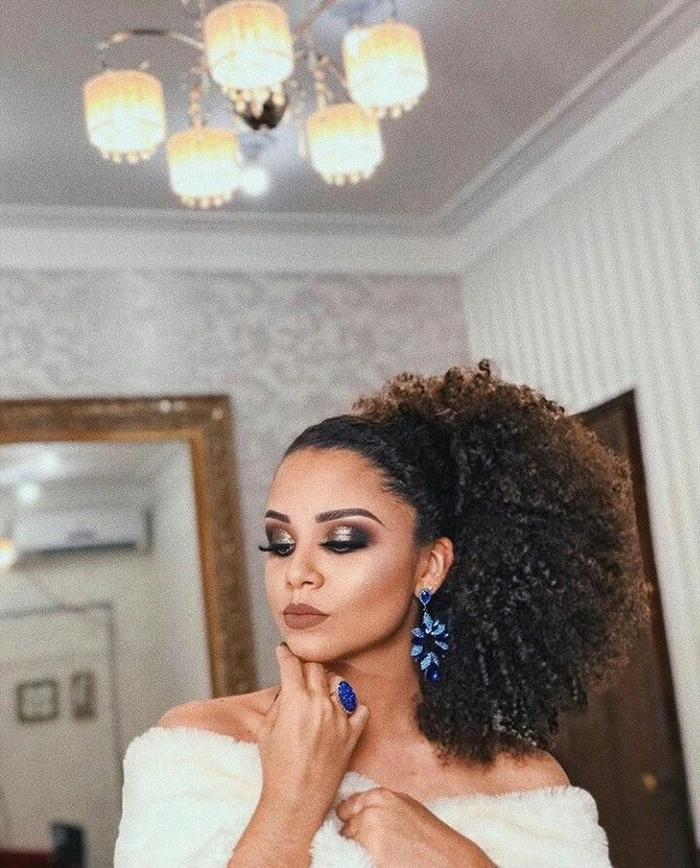 Elegant birthday party high top knot with sleek finish High sleek top knot hairstyle for a birthday party celebration