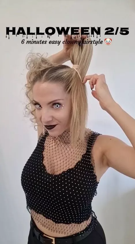 Woman with edgy space buns and bold club makeup