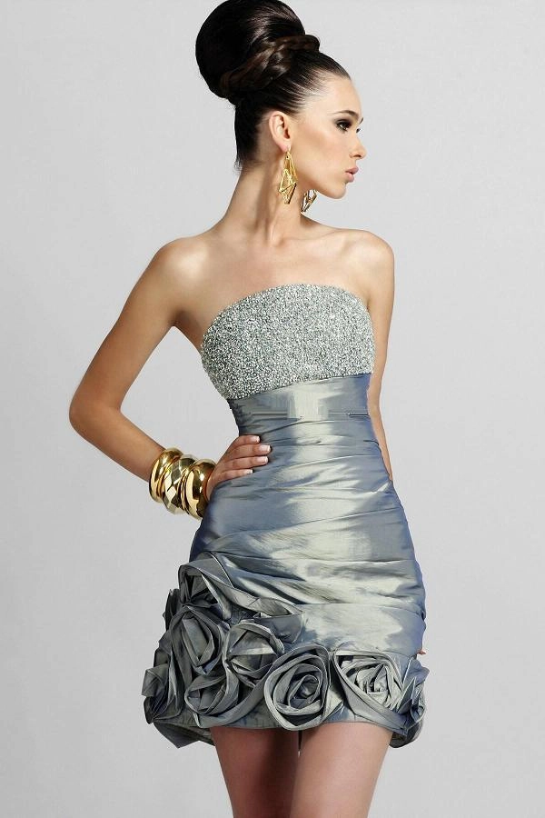 Woman with a braided halo hairstyle at a cocktail party wearing an elegant dress