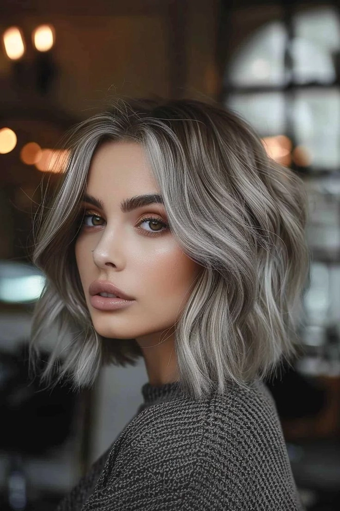 Silver grey cocktail party hairstyle with elegant waves and subtle accessories