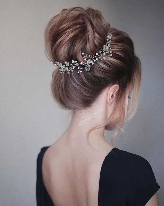 Updo hairstyle with hair extensions for a chic cocktail party look Elegant cocktail party updo with hair extensions featuring twisted bun and side curls