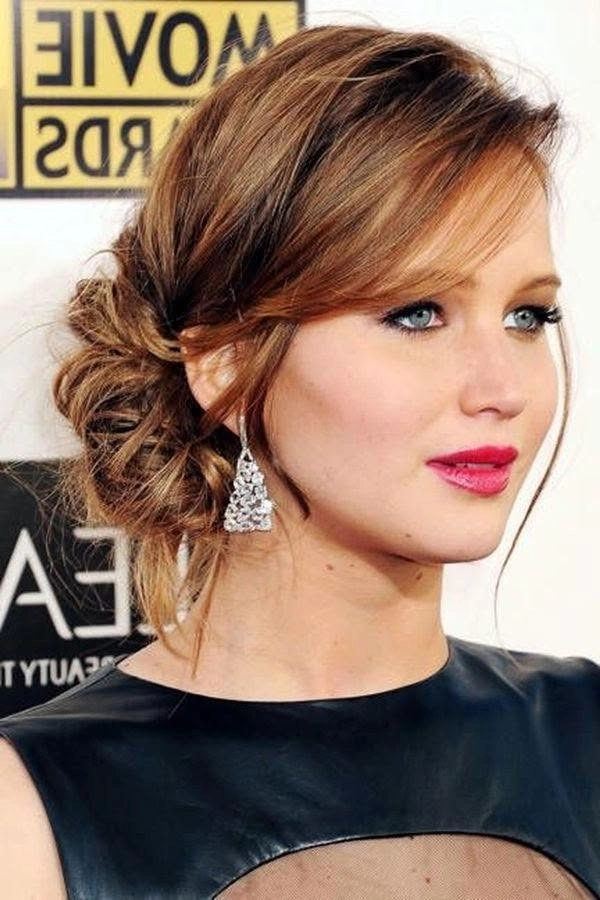 Chic updo for cocktail parties featuring voluminous hair extensions Elegant cocktail party updo hairstyle with hair extensions