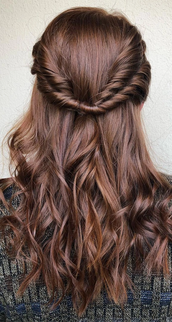 Elegant engagement party half-up style with romantic twisted details and delicate accessories Romantic half-up hairstyle for engagement party with soft curls and floral accents