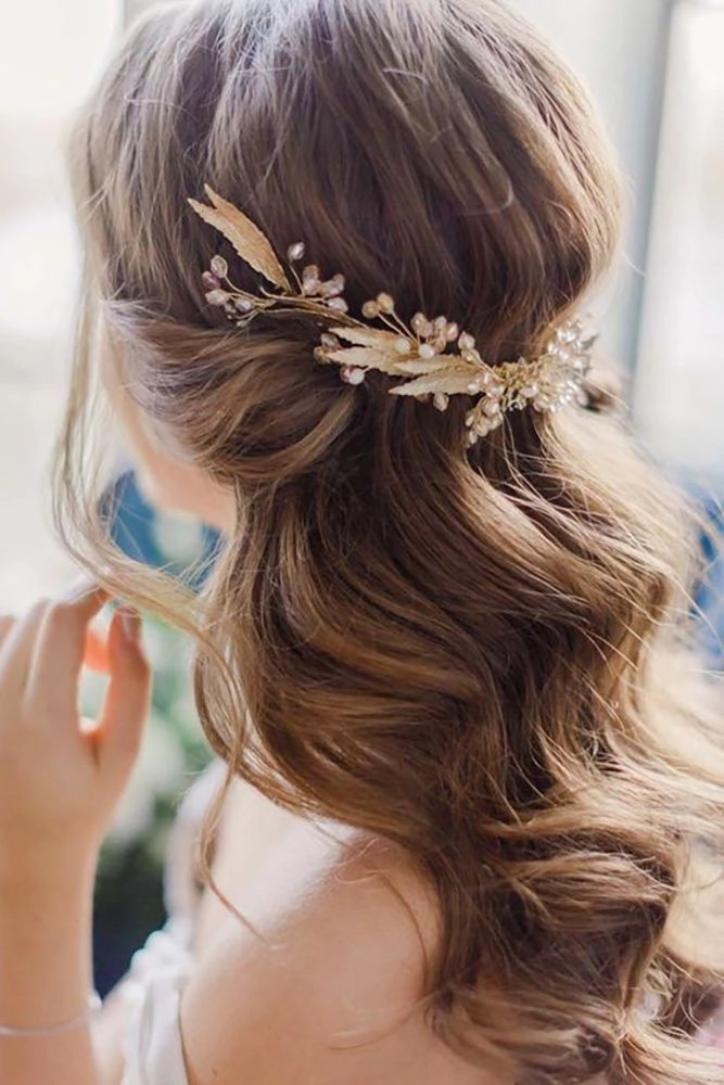 Engagement party hairstyle featuring soft romantic half up curls and details Romantic half-up hairstyle perfect for an engagement party celebration
