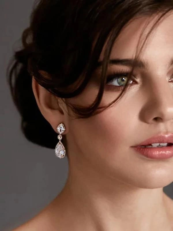 Elegant evening updo with sparkling statement earrings