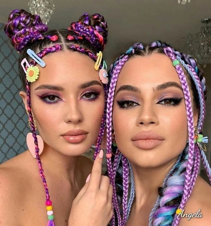 Festival braids with hidden rainbow underlights peeking through, perfect for a party hairstyle