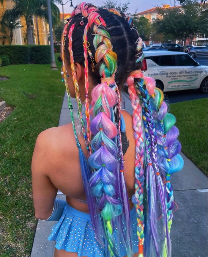 Festival braids with hidden rainbow underlights for a party hairstyle