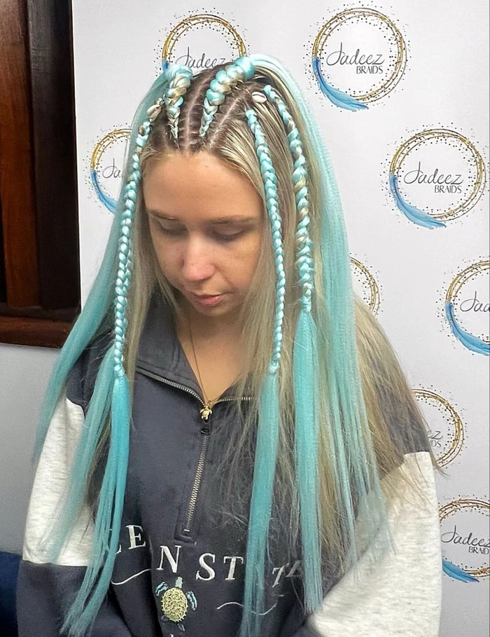 Festival braids with metallic thread party hairstyle inspiration Festival braids woven with shimmering metallic thread for a party hairstyle