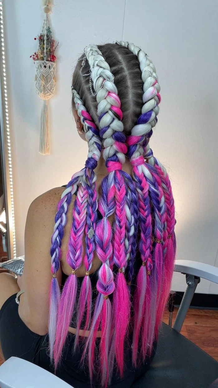 Festival hairstyle featuring metallic threaded braids Festival braids woven with metallic thread for a party hairstyle