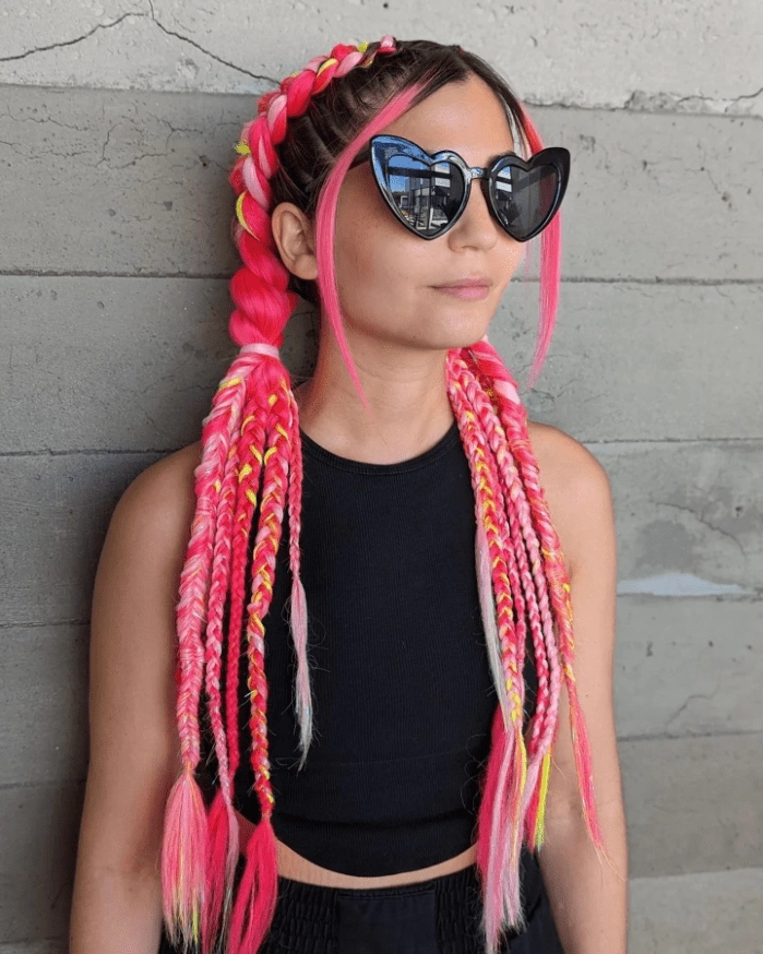 Festival braids with metallic thread shimmering for a party look Shiny metallic thread woven through festival braids for a party hairstyle