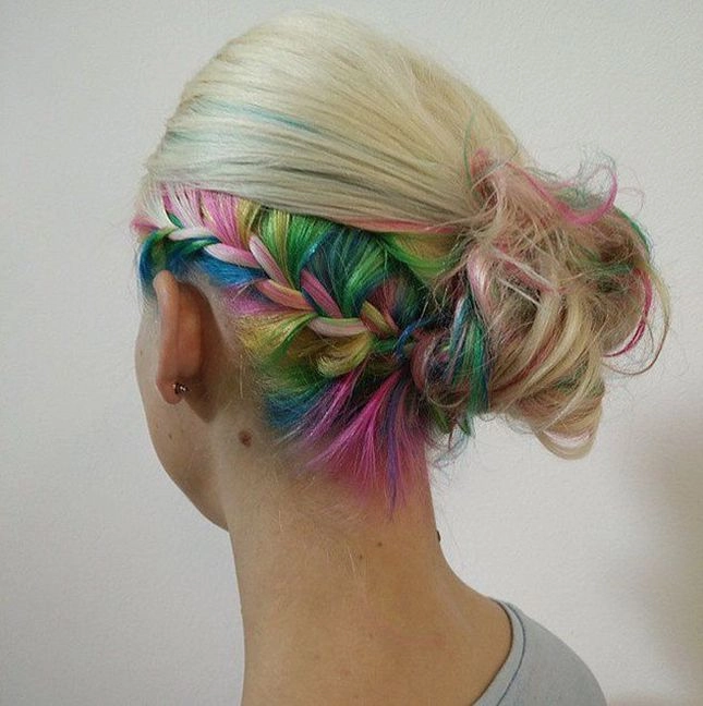 Festival braids with hidden rainbow underlights peeking through the dark hair