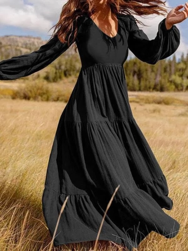 Festival hairstyle with loose waves and floral accessories paired with a flowy bohemian maxi dress for a party look