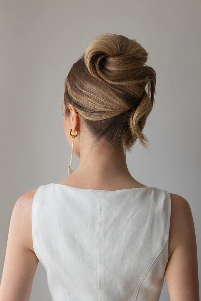 Party French twist updo suitable for formal gowns - hairstyle image 8 Elegant French twist updo styled for a formal party, paired with a gown