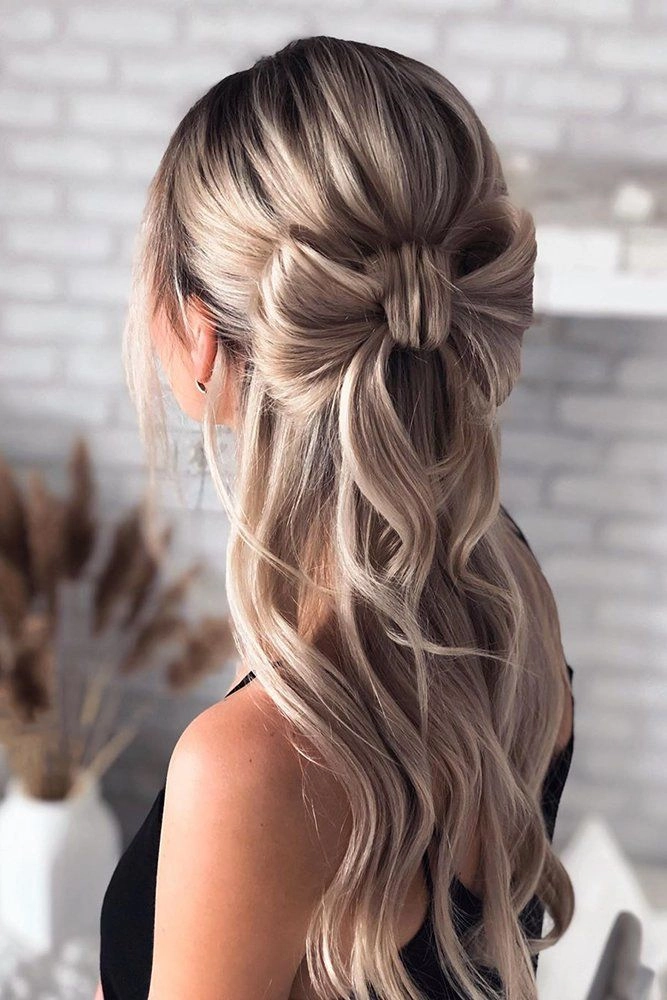 Wedding guest hairstyle for frizzy hair, elegant updo with soft curls