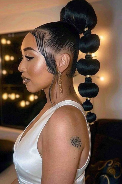 Woman with a sophisticated chignon embellished with a velvet scrunchie at a formal gala