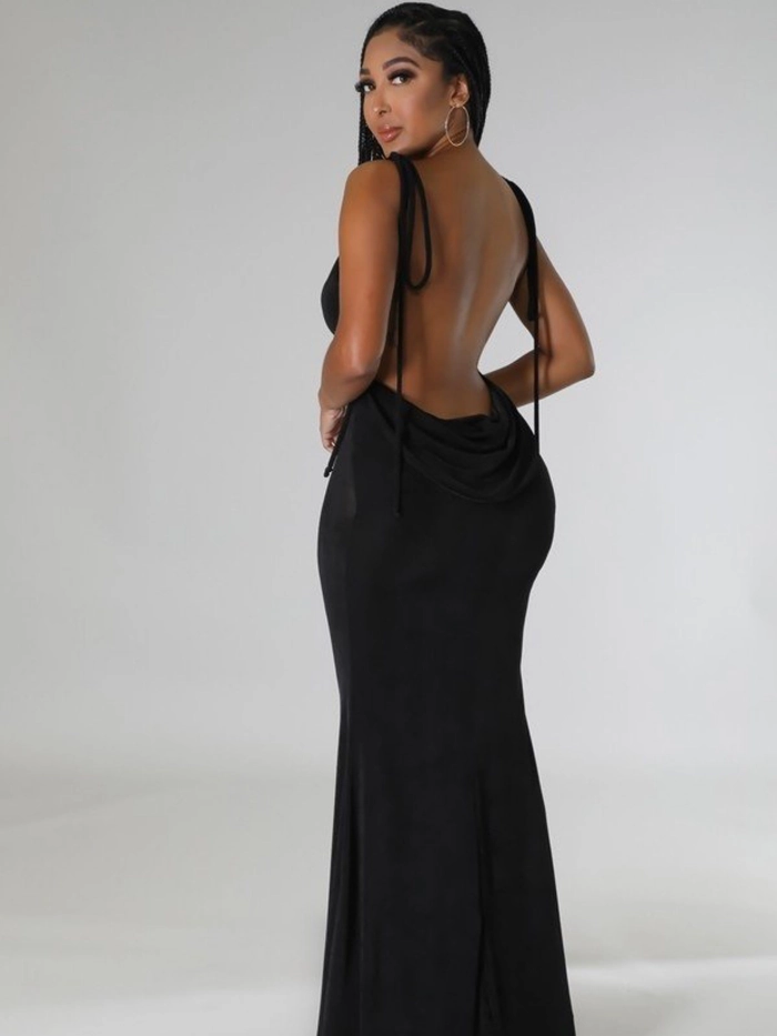Elegant updo hairstyle for a gala, designed to complement a backless evening gown