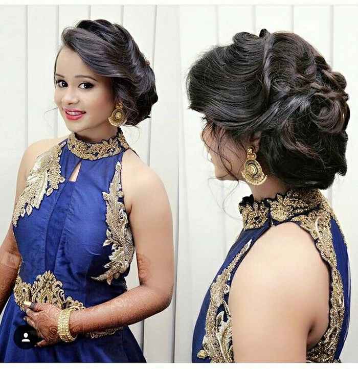 Elegant gala updo hairstyle complementing a backless evening gown, side view.