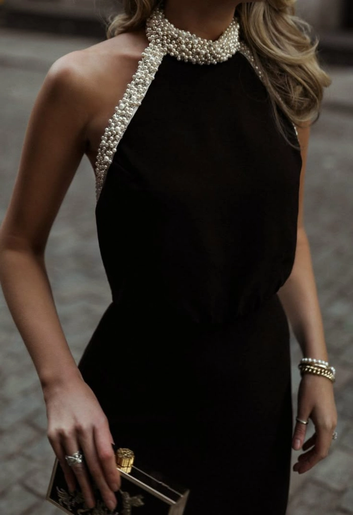 Elegant gala updo hairstyle complementing backless evening wear