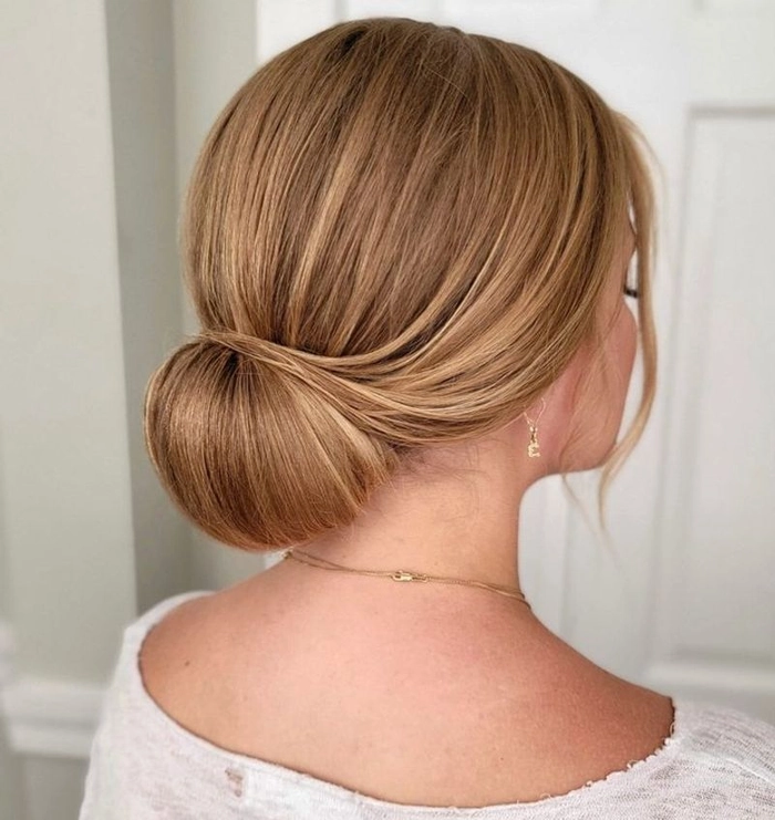 Elegant updo with gold hair cuffs for cocktail party style Gold hair cuffs accent a swept-up cocktail party hairstyle