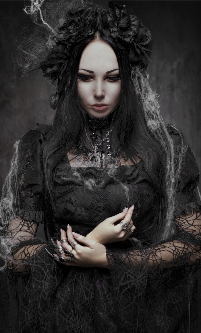 Gothic prom hairstyle with dark accessories, featuring intricate braids and a black choker