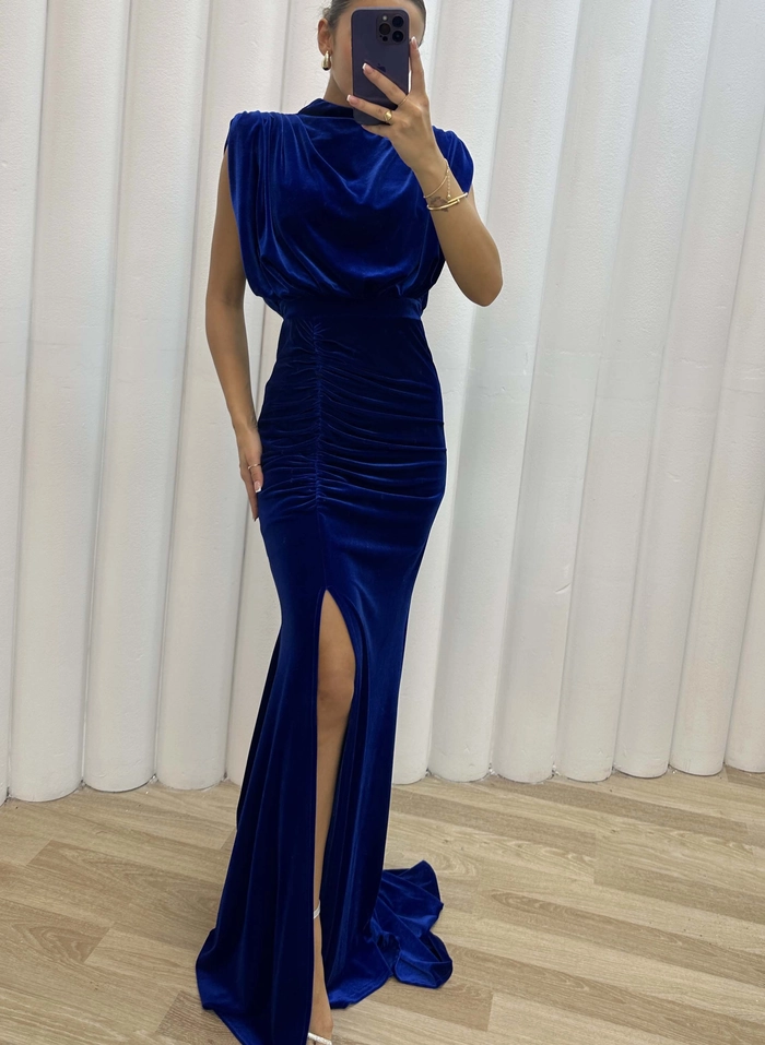 Elegant half-up twist hairstyle with soft waves complementing a high neck velvet gown