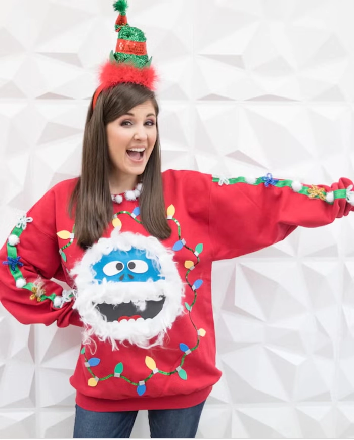 Holiday party hairstyle paired with an ugly Christmas sweater featuring playful festive details