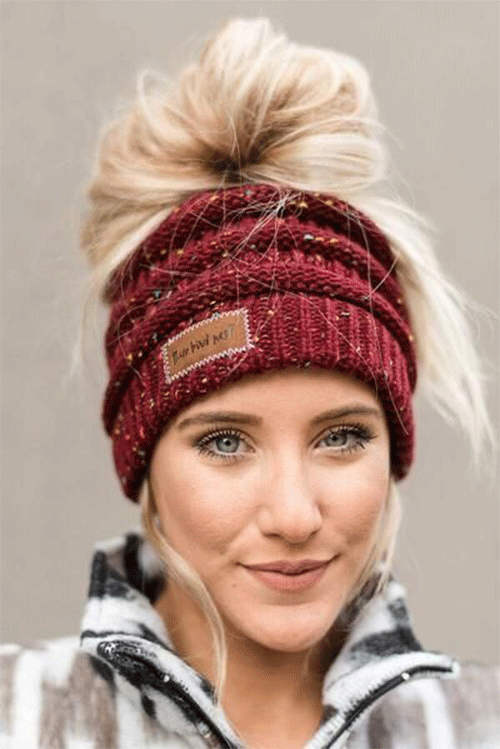A chic hat-friendly party hairstyle featuring a sleek low twist, perfect for winter galas