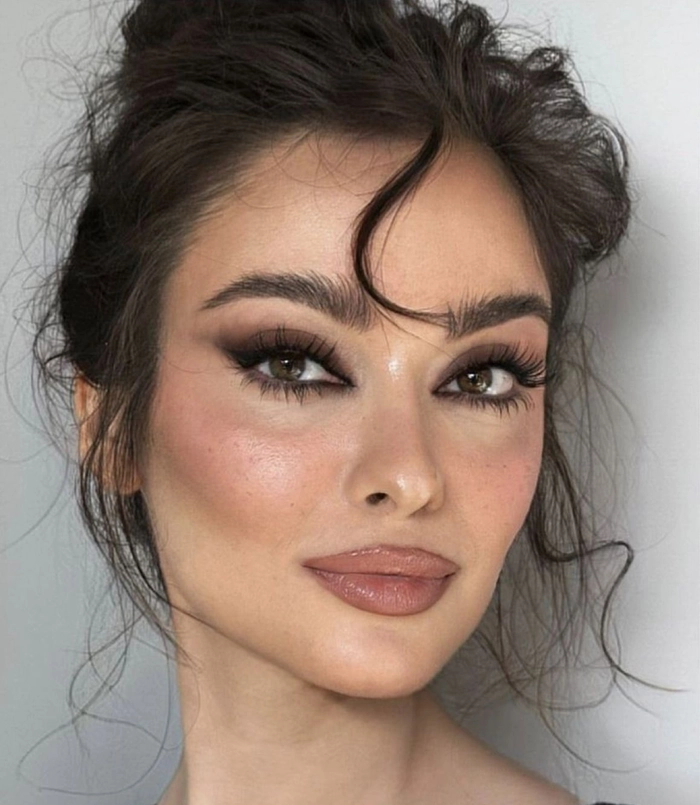 Dark brunette glossy hair clubbing style with voluminous waves