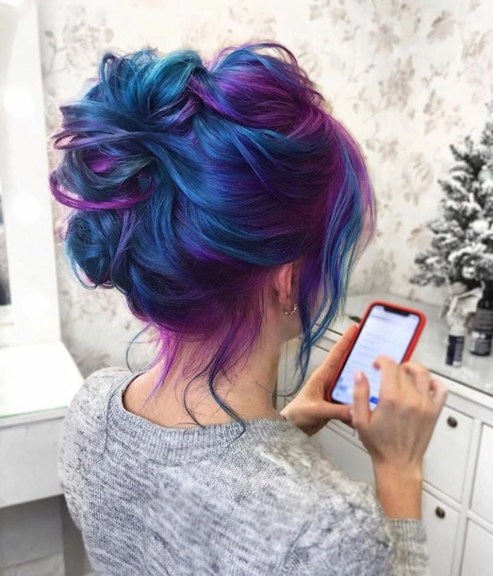Stunning evening updo with vivid fantasy hair colors for a party hairstyle