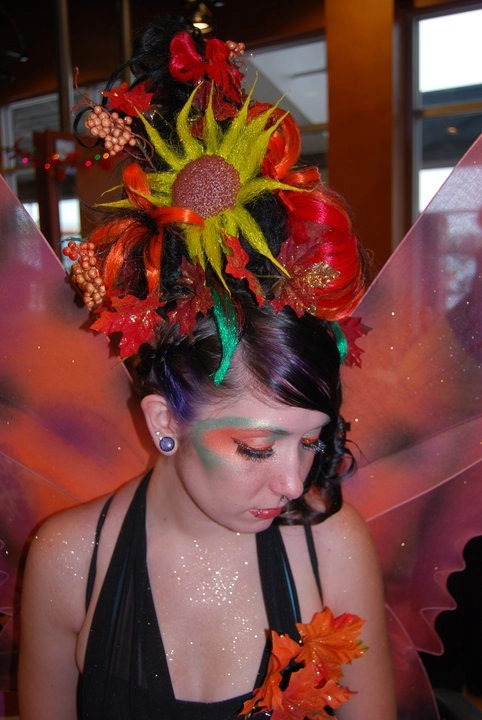 Evening updo with vivid fantasy hair colors for a party hairstyle