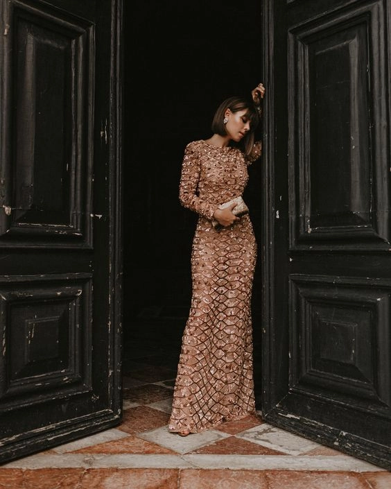 Wedding guest hairstyle complementing a heavy beaded formal gown