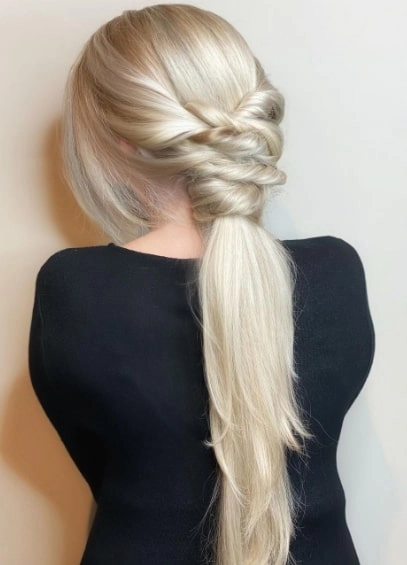 New Year's Eve party hairstyle paired with a metallic mini dress