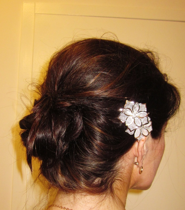 Elegant evening updo with sparkling statement earrings for party glamour