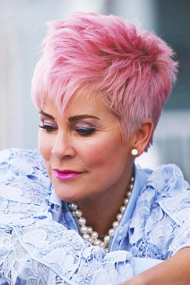 Elegant short party hairstyle with volume and shine for women over 50 Party hairstyles for women over fifty with short hair showcasing a chic updo with sparkling accessories