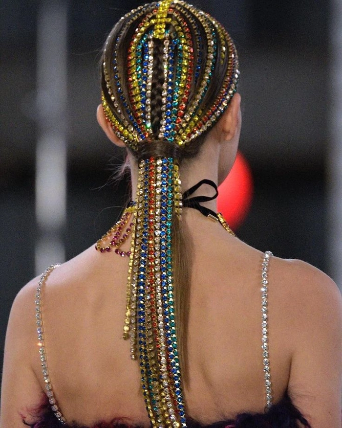 Party Hairstyle 5: Bold rhinestone-adorned updo for festive celebrations Maximalist party hairstyle featuring heavy rhinestone accessories and dramatic volume