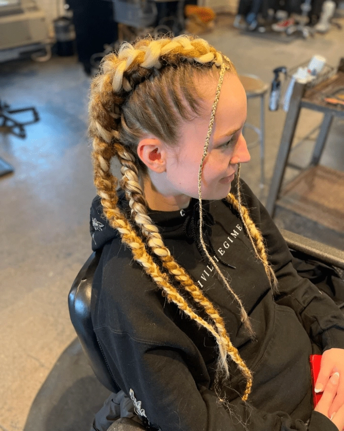 Festival Braids with Metallic Thread for Party Hairstyles - Image 7 Festival braids woven with shimmering metallic thread in a party hairstyle