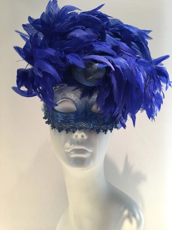 Party hairstyles: masquerade ball hair perfectly paired with a feather mask Elegant updo hairstyle that complements a feather mask for a masquerade ball