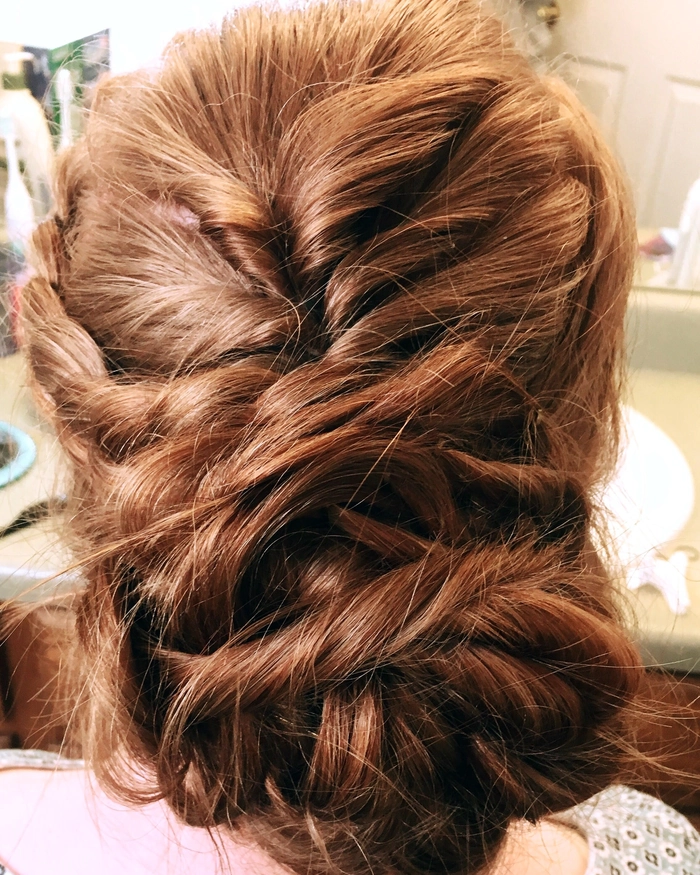 Woman with a secure twisted updo ready for dancing all night