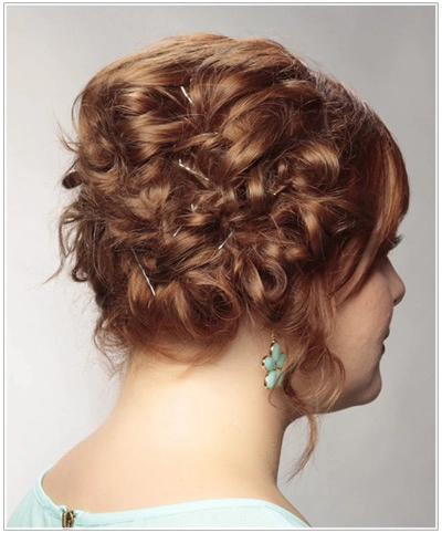 Elegant updo secured with pins and hairspray, ready for hours of dancing