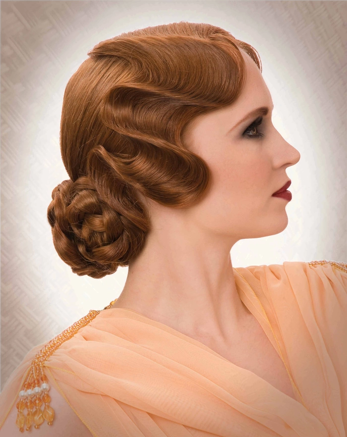 Classic 1920s finger waves styled for a mysterious masquerade ball look Elegant vintage finger waves paired with a masquerade ball mask for a glamorous party hairstyle