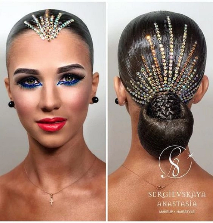 Maximalist party hairstyle featuring rhinestone accessories for a bold celebration look A woman with maximalist party hair styled with heavy rhinestone accessories, sparkling under party lights