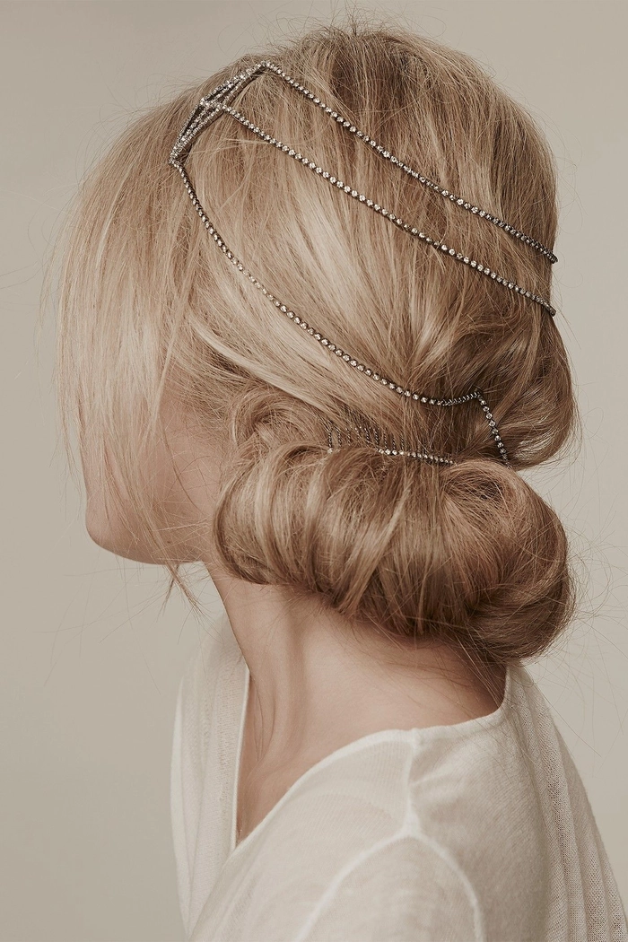 Dazzling rhinestone-embellished party hairstyle for maximum impact A glamorous party updo adorned with sparkling rhinestone hair accessories