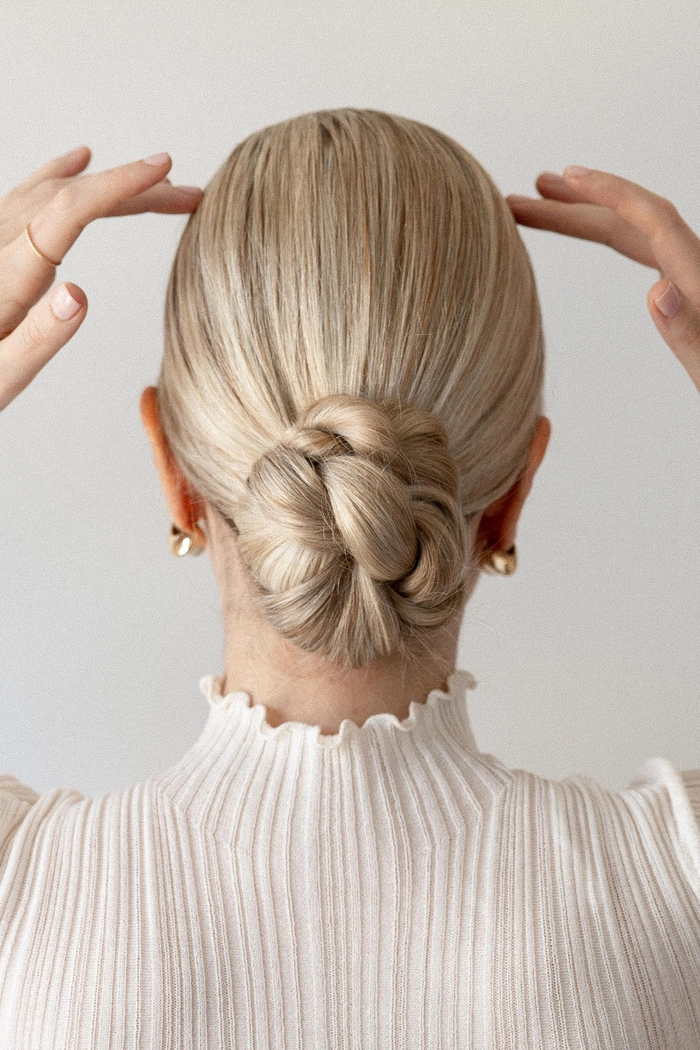 Minimalist sleek party bun - elegant updo for formal occasions Sleek minimalist party bun hairstyle for formal events