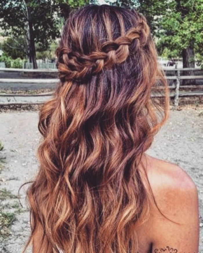 bohemian music festival hairstyle with braided crown of flowers and ribbons