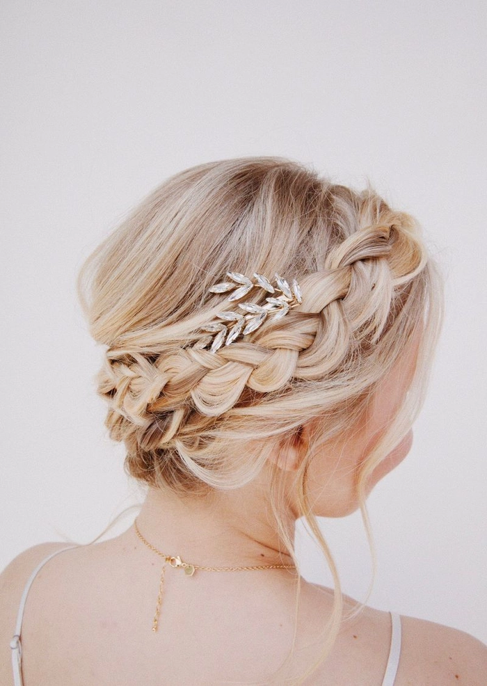 A music festival attendee with a boho braided crown hairstyle