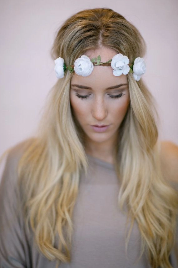 Woman with boho braided flower crown at outdoor music festival