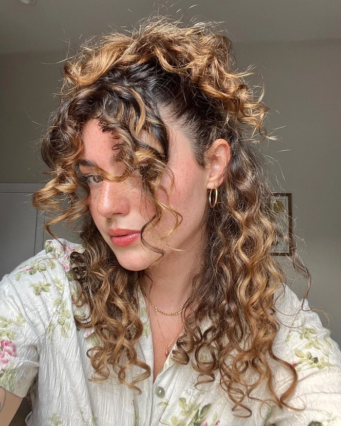Elegant party updo showcasing natural tight curls Party updo hairstyle for natural tight curl pattern hair