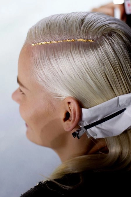 New Year's Eve party hairstyle featuring glitter root application for sparkle
