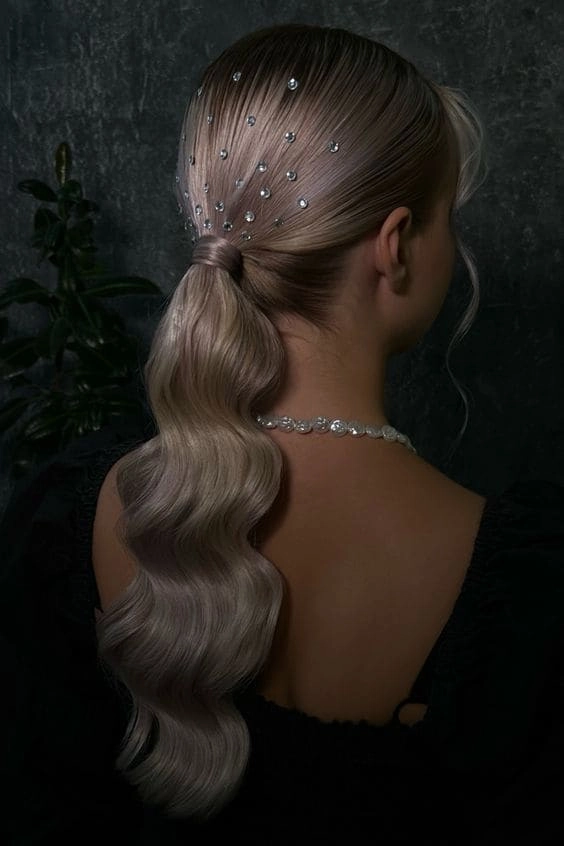 New Year's Eve hairstyle complementing a metallic mini dress